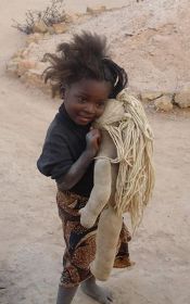 Anna and her doll, the photo that inspired Pearl McCormick to knit teddies for children in Kitwe, Zambia.